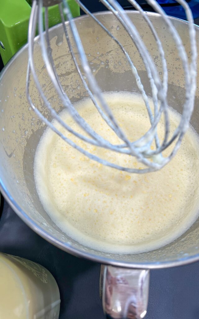 Raw milk being whipped in a kitchen aid 